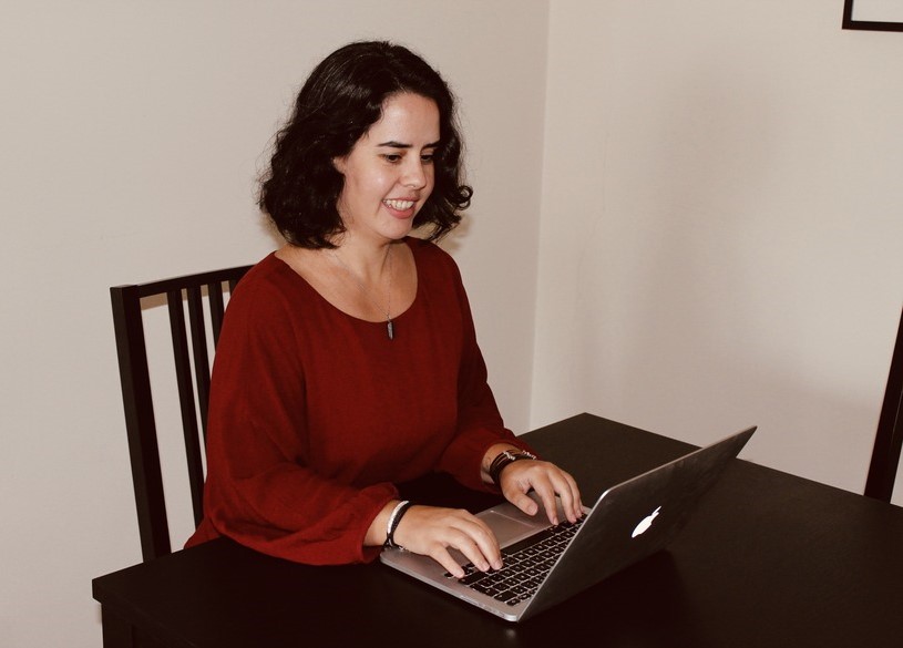 An upper body photo of Ana at the computer